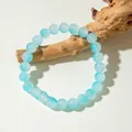 Light blue beaded bracelet with translucent glass beads on natural wood stand - Light Blue (29960-4-blue)