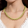 Detail of green beaded bohemian necklace with golden teardrop pendants on model - Grass Green (29892-nek-lg)