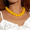 Fashionable bright yellow acrylic beaded necklace shown on model with satin dress - Yellow(27326)