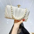 Elegant pleated satin evening clutch in beige featuring a pearl handle and gold clasp - Apricot With Rhinestone Pearl Chain