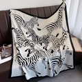 Detailed texture of black and white zebra print scarf displayed on a leather sofa - 90*90cm / White (HSM-56)