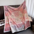 Detail of floral silk scarf with leopard and tropical palm print on leather sofa - Pink (HSM-44-Pink)