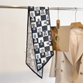 Detail of double-sided twilly scarf with checkerboard and chess piece pattern - Black & White Checkerboard