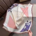 Detail of elegant silk-like square scarf with geometric patches and abstract floral pattern - Pink
