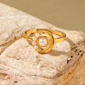 Elegant gold-plated ring with layered white pearls displayed on a natural stone base - Gradient Five Pearl Ring (30419-ring-1)