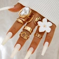 Set of 7 gold geometric rings with baroque pearls and white flower details worn on hand - Gold Baroque Irregular Pearl Style (29170-r-G white-3) / 7-Pack Set / Gold