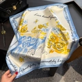 Silk square scarf with floral print and inspirational quotes on a leather bag - 53x53cm / Beige