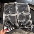 Polka dot silk square scarf in black and white styled with a leather bag and sunglasses - Black (Polka Dot Striped Splice)