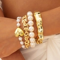 Gold-finish textured wide cuff and pearl beaded charm bracelet set for women - Textured Bangle With Heart Pearl Chain (30240-bra-G)