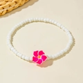 Detailed shot of handmade beaded anklet with vibrant pink frangipani flower and white beads - Deep Pink Frangipani Style