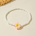 Detail of bohemian beaded anklet with resin plumeria flower and white round beads - Pink Frangipani Style