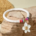 Detail of Bohemian beaded anklet with white heishi clay discs and frangipani flower charm - White Polymer Clay Multicolor Accent Flower Style