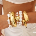 Golden liquid-fold wide bangles and layered pearl bracelets set with heart charm - Minimalist Luxury Heart Pearl Set (30329-bra-G)