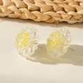 Chic yellow floral earrings with layered crystal petals on a natural woven background - Yellow