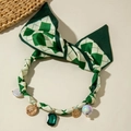 Green argyle ribbon necklace with vintage gold charms and pearls on a beige background - Green White Argyle With Retro Coin Gem Pendant (30528-nek-green-1)