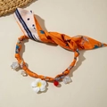 Detailed shot of orange silk scarf necklace with dragonfly print and pearl pendants - Orange Dragonfly Print With Flower Pendant (30528-nek-orange)
