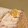 Elegant gold shell ring with white pearls and zircon on natural rock surface - Fine Shell Texture Ring (30419-ring-4)