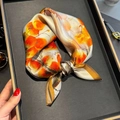 Silk neck scarf with orange floral pattern and hand-rolled edges on a display tray - 53*53cm / Beige Orange Floral (ZS-514-Beige)