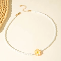 Bohemian style beaded necklace with white cylindrical beads and resin plumeria flower - Yellow (29919-nek-yel)