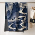 Detail showing blue jacquard landscape pattern on thick cashmere-feel scarf with tassels - Blue