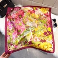 Elegant burgundy silk square scarf with floral print draped over a luxury black handbag - Rose Red (Realistic Floral)