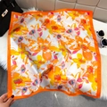 Elegant square silk scarf featuring bright orange floral patterns on a white background - Orange (Large Floral)