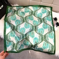 Elegant white square silk scarf with green fan-leaf patterns on a soft plush rug - Green (Fan Leaf Texture)