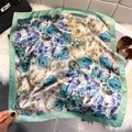 Mint green vintage silk square scarf with floral print styled on a plush white surface - Emerald Green (French Floral)