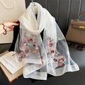 Close-up of elegant floral embroidery on a white translucent lightweight chiffon scarf - 90*192cm / White