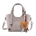 Taupe pebbled leather handbag with round handles and a cute plush bear charm decoration - With Pendant / Gray