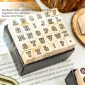 Juego de 30 sellos de madera vintage con letras mayúsculas y símbolos en caja de cartón - Inspiración Inglesa