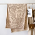 Detail of beige and brown leaf pattern scarf with fine tassels on a metal hanger - Pink (GSJ-349-Pink)