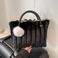Black faux fur tote bag with striped texture, plush ball charm and woven handle - Black (With Charm)