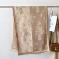 Detail of camel and beige cashmere shawl featuring retro bamboo prints and fringe - Khaki