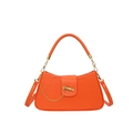 Chic orange box-shaped crossbody bag with gold chain and knot closure on white background - Orange