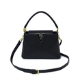 Elegant black quilted bucket bag with golden V-hardware and versatile shoulder strap - Black