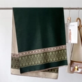 Detail of ethnic geometric pattern and short fringes on a double-sided scarf - Emerald Green