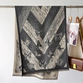 Detail of butterfly jacquard scarf with herringbone pattern and fringe edges - Gray