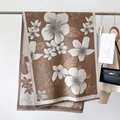Detail of floral printed scarf with fringe edges hung with a beige trench coat - 186cmx66cm / Khaki