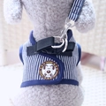 Blue and white striped dog harness and leash set with cartoon patch on model - Blue Vertical Stripes (Brown Label)