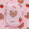 Close-up of pink coral fleece dog hoodie with cute strawberry bear pattern and soft texture - Pink Strawberry Bear
