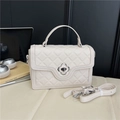 Quilted cream crossbody bag with silver clover lock and adjustable shoulder strap - White