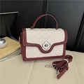 Beige and burgundy quilted crossbody bag with floral clasp and adjustable strap - White and Red