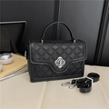 Classic black quilted crossbody bag with silver flower clasp and adjustable strap - Black