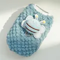 Macro detail of blue fleece dog vest with soft honeybee toy and metal D-ring attachment - XXS / Blue