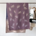 Detailed view of two-tone purple and beige scarf with ginkgo leaf print and soft tassels - Purple