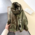 Close-up of bamboo print scarf with fine fringe detail and soft cashmere texture - Dark Green
