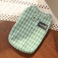 Detail of green plaid pet vest with a metal D-ring and black fashion leather label - S / Vintage Green Plaid