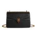 Black lychee leather crossbody bag with bronze lion head emblem and chain strap - Black