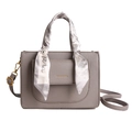 Grey pebbled leather handbag with decorative silk scarf and adjustable strap - Gray